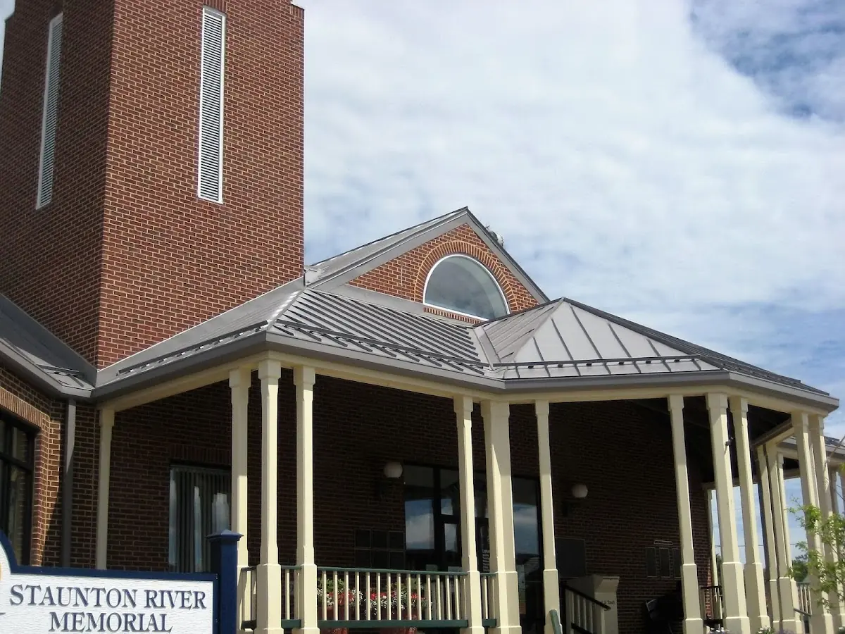 Skilled roofing craftsmen working on a residential roof in West Shore